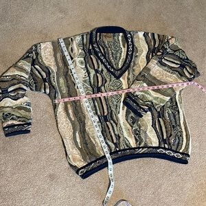 COOGI XL multi colored sweater. Hardly worn just a couple pulls easy fix!